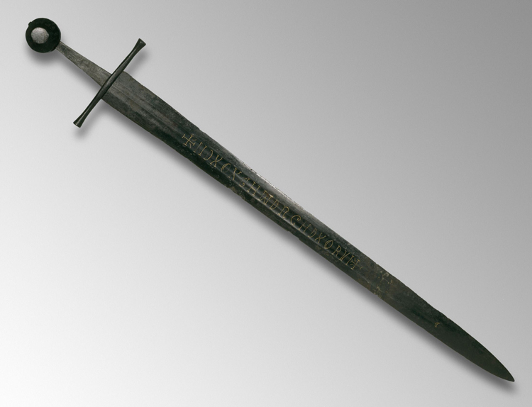 An image of a large sword on a table.
